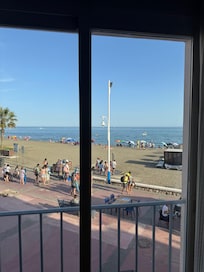 view out of the sliding glass door. One floor up, so not on street level. To get to the beach, just walk out the back door!