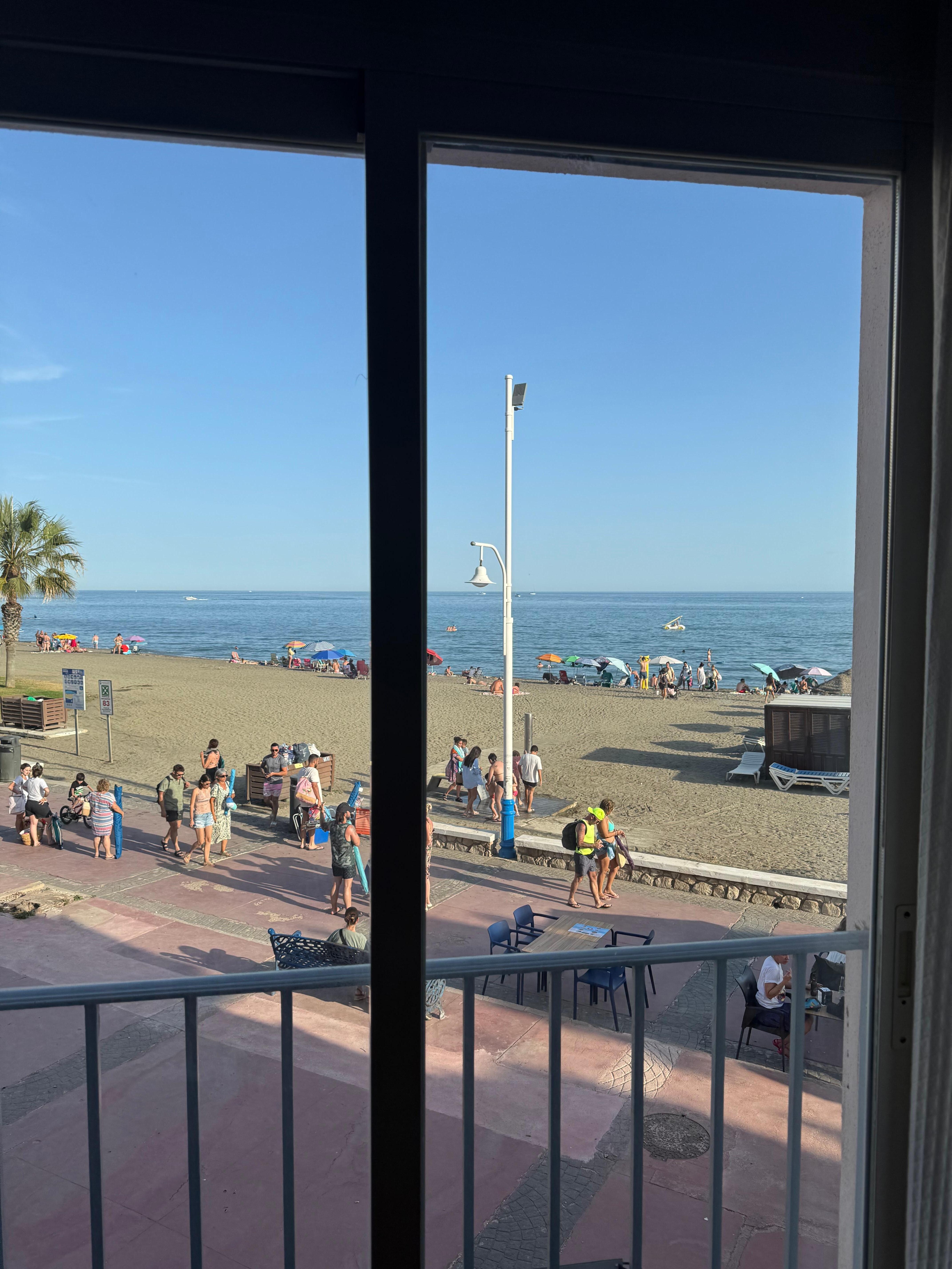 view out of the sliding glass door. One floor up, so not on street level. To get to the beach, just walk out the back door!