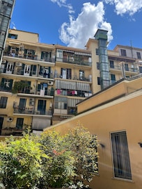 Hotel is actually a small building situated in a courtyard surrounded by apartment balconies, many with laundry hanging - for days. Some barking dogs, screaming neighbors. Bars on some windows.