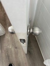 Bathroom door knob falling off.