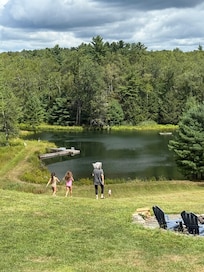Walking to lake to paddle boat and fish.