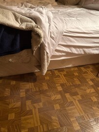 Bed on the floor; no frame.