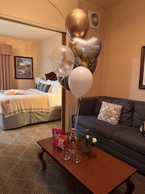 Anniversary balloons, wine, and goodies.