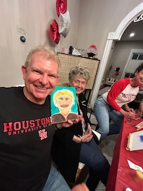 The graduate’s dad with a not so great portrait of my mom