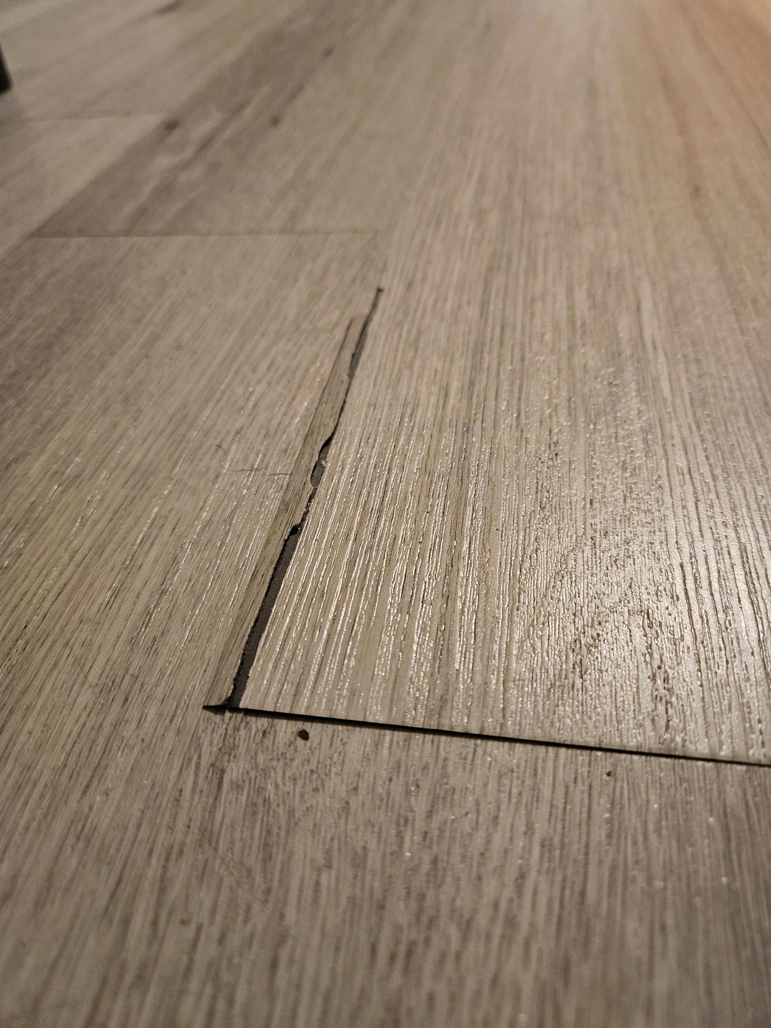 Laminate floor had sharp and lifted areas with the potential to cut our feet in multiple areas of the hotel room.
