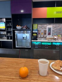 The lone milk jug and the yogurt dispenser.