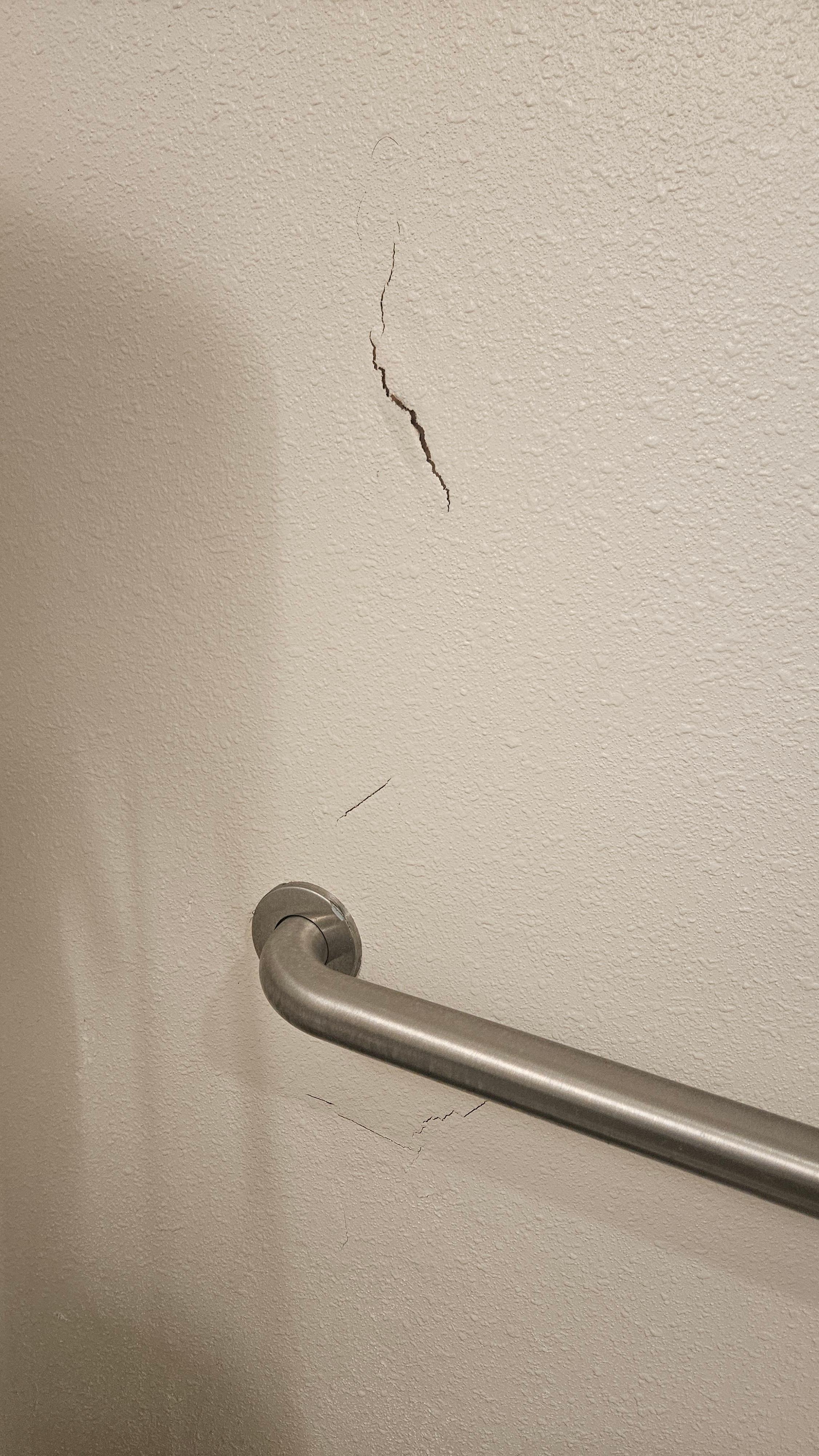 Cracked wall near toilet 
