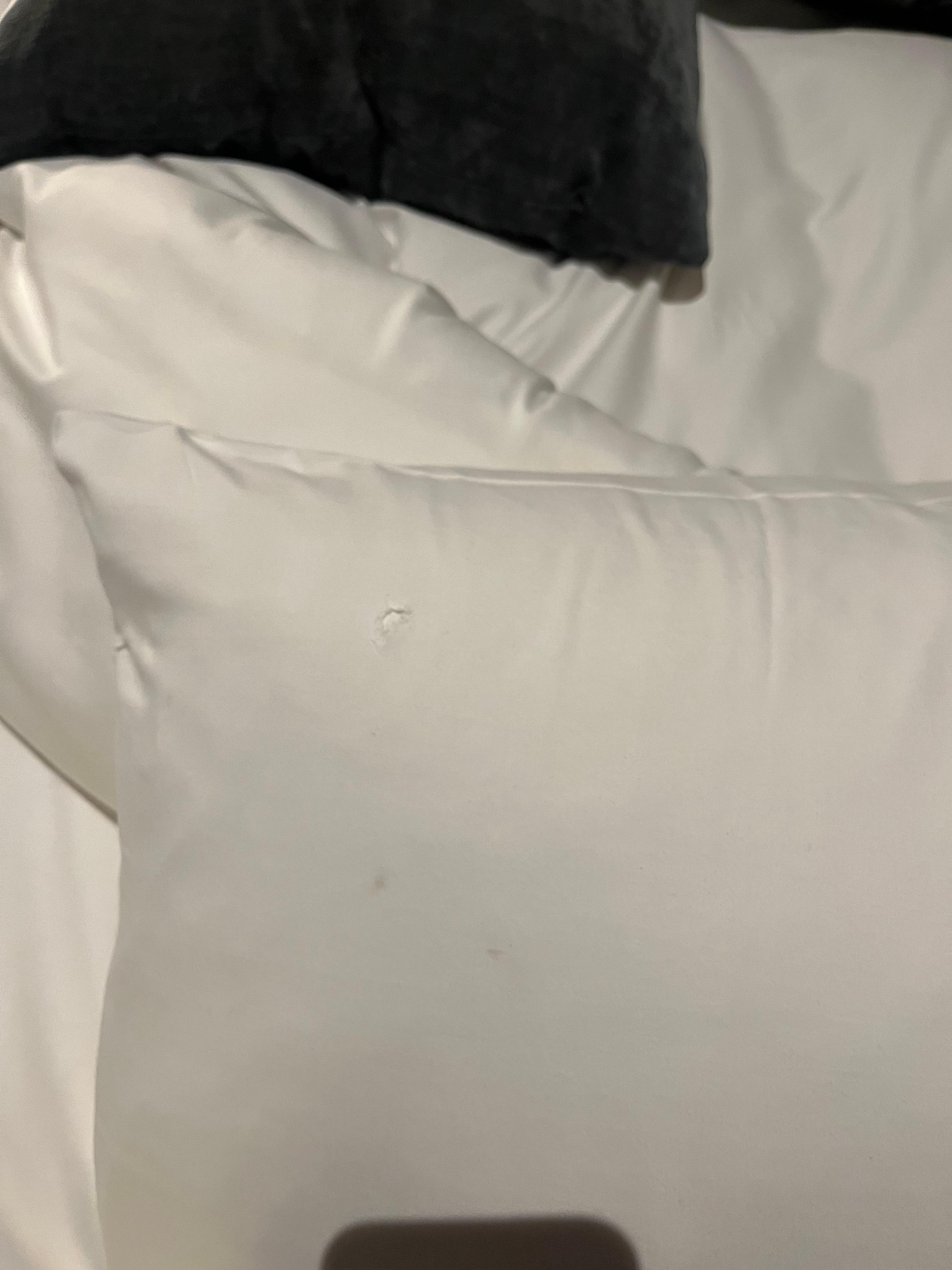Hole and marks on pillow
