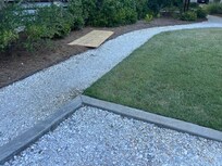 This is the parking lot that leads to wheelchair ramp. A two/three inch curb sits.