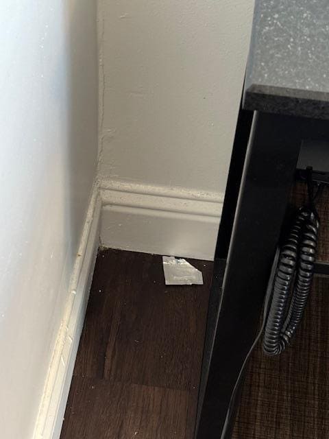 Empty condom wrapper discarded in the room