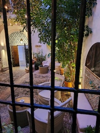 Room windie looking out to inner courtyard and dining area.