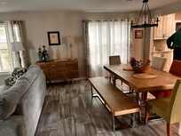 dining area between living room area and kitchen