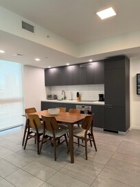 Minimalist kitchen has everything you need integrated into the cabinets.