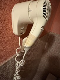 Professional repair of the hairdryer with masking tape