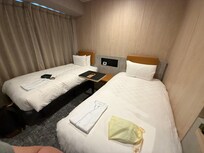 It is a small room with limited area to open oversized luggages