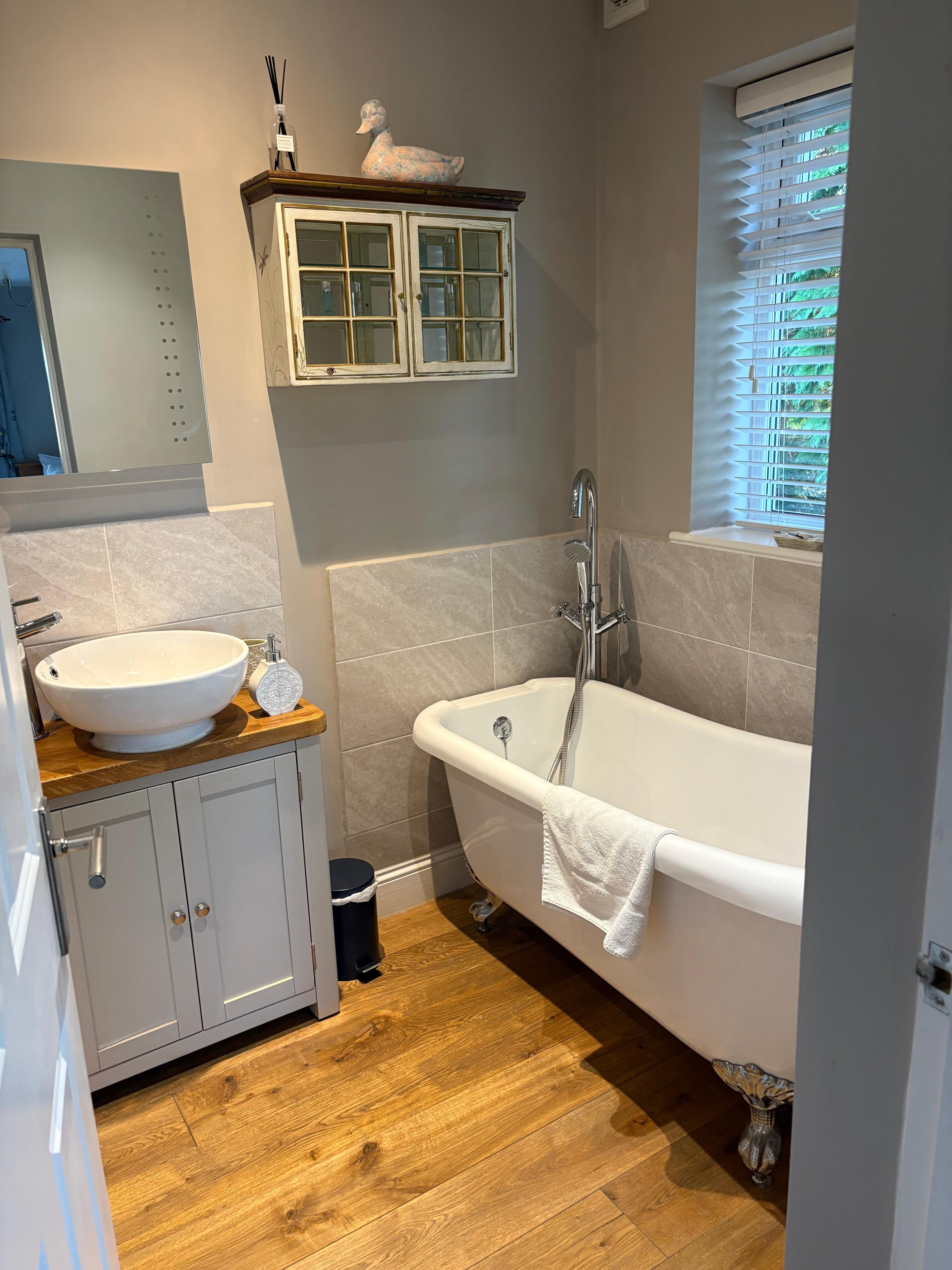 Beautiful and clean bathroom with towels provided