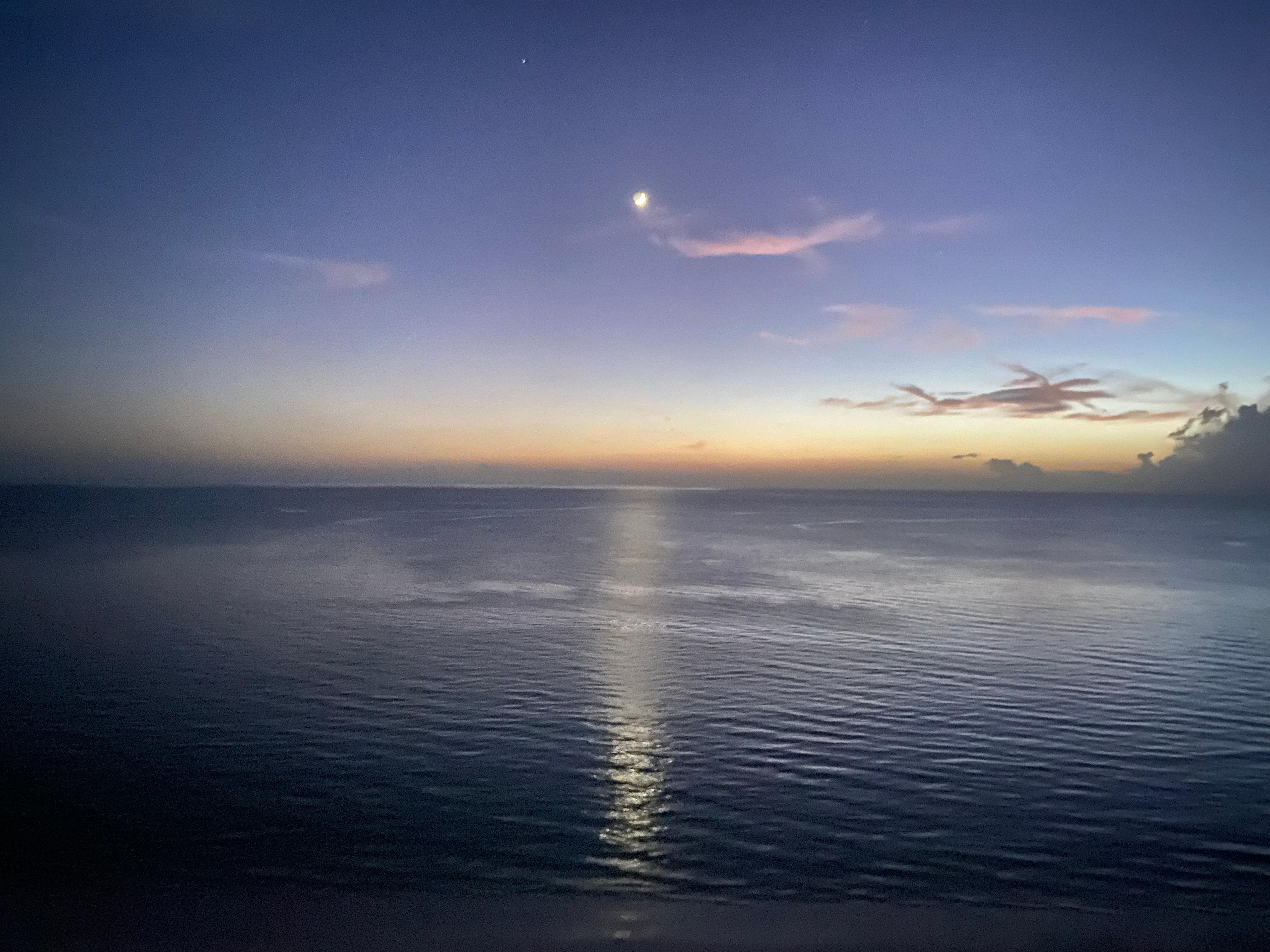 Moon reflection on the water from the balcony.