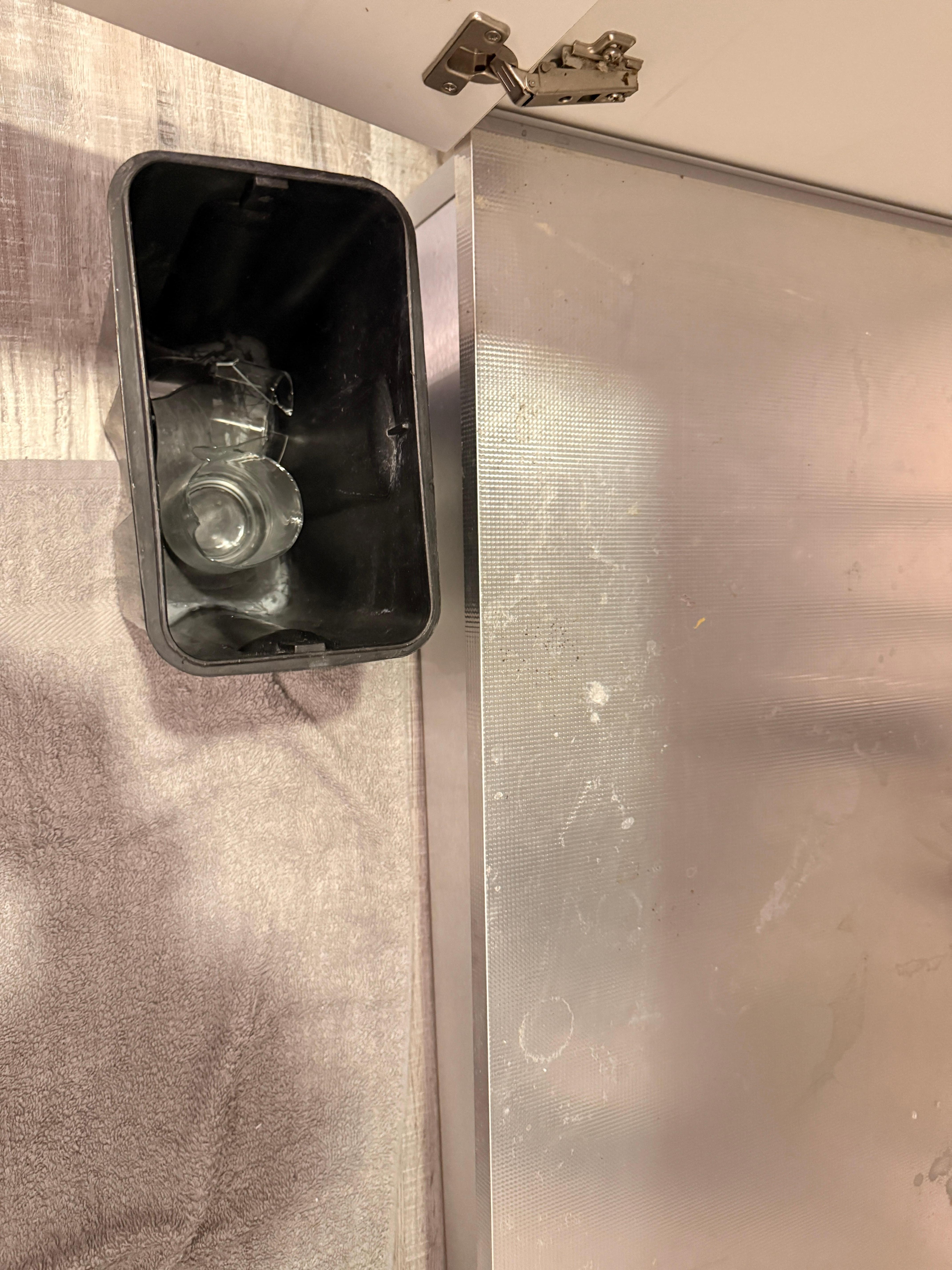 Can under sink left with broken glass. Found some pieces on floor also. Filthy under sink you can see. 