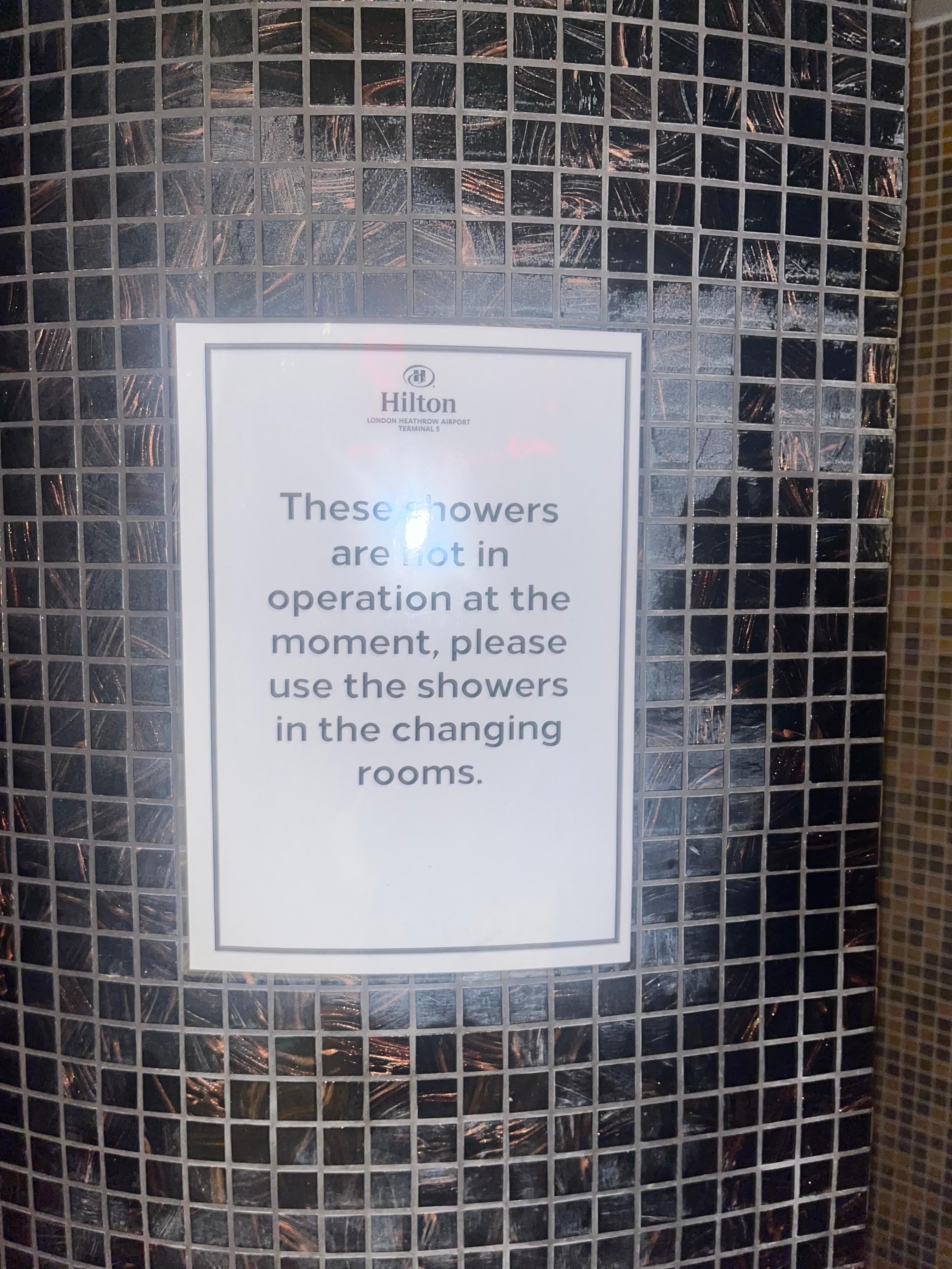 There was at least a sign but you had to go into the changing rooms to use the shower which was a distance away 