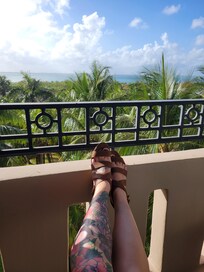 Balcony view in sunset room, sea tower