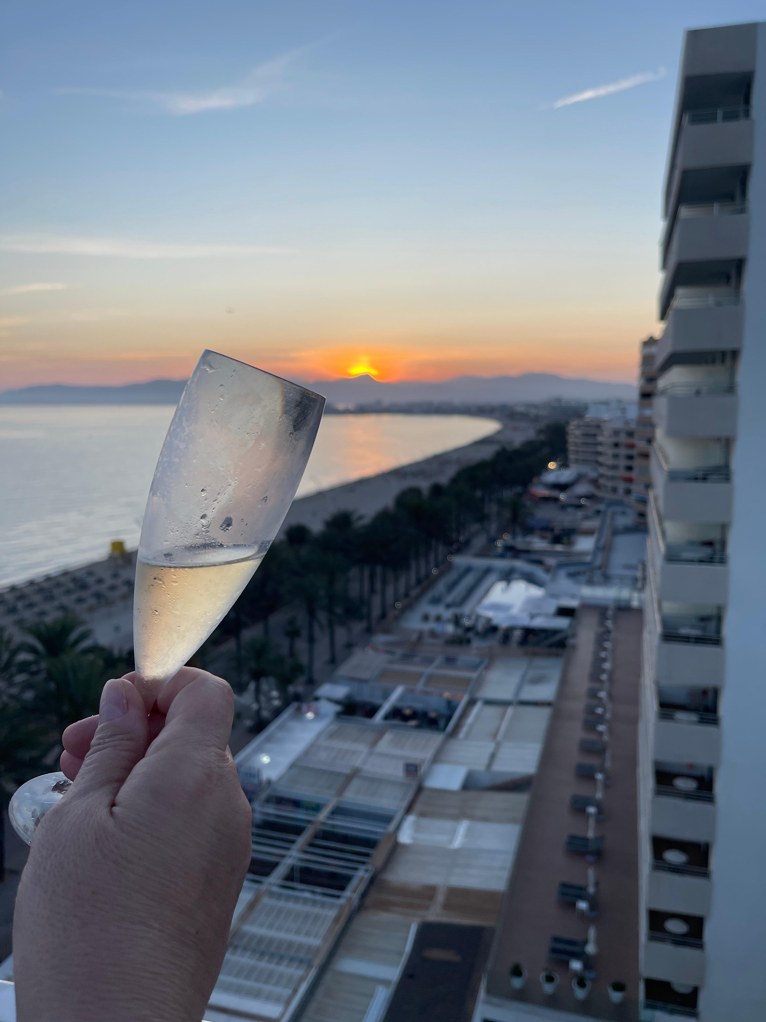 Sunset with a complimentary glass of cava at the rooftop pool. 