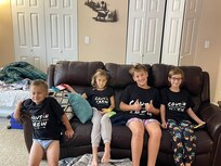 kids matching shirts in basement