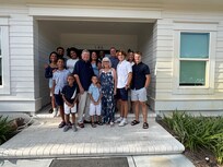 Family photo outside home