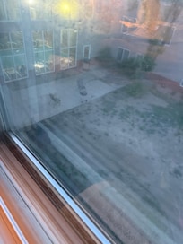 Here's the courtyards barbecue and two chairs to sit outside