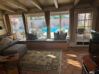 TV area looking out over patio and pool