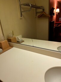 Broken mirror, dirty sink