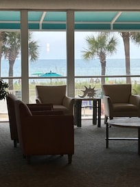 Standing in lobby of hotel looking toward ocean