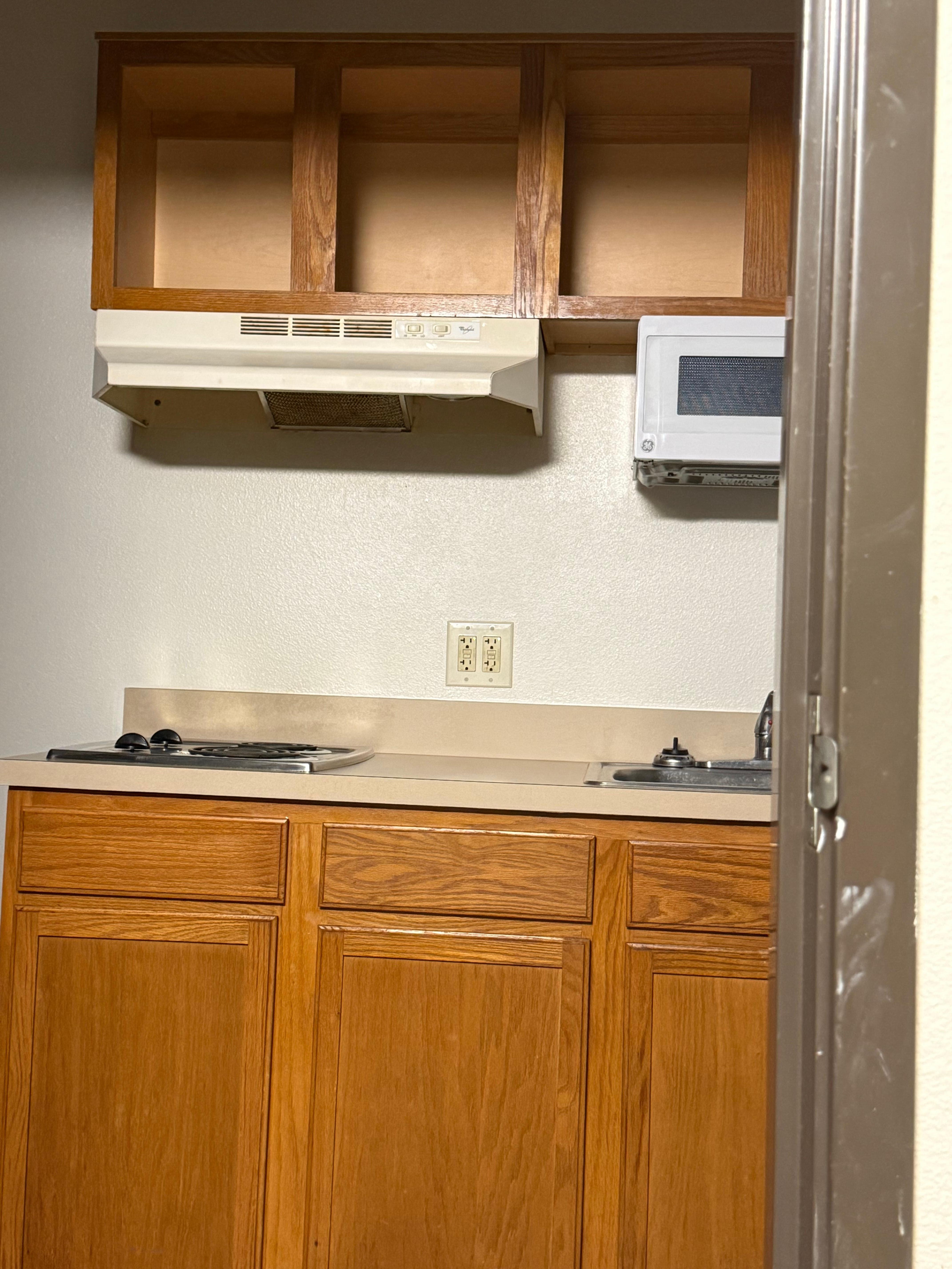 Whole area had exposed conduit, was greasy, and covered in fly/insect poop.