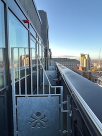 Looking along the side of the building at the balconies