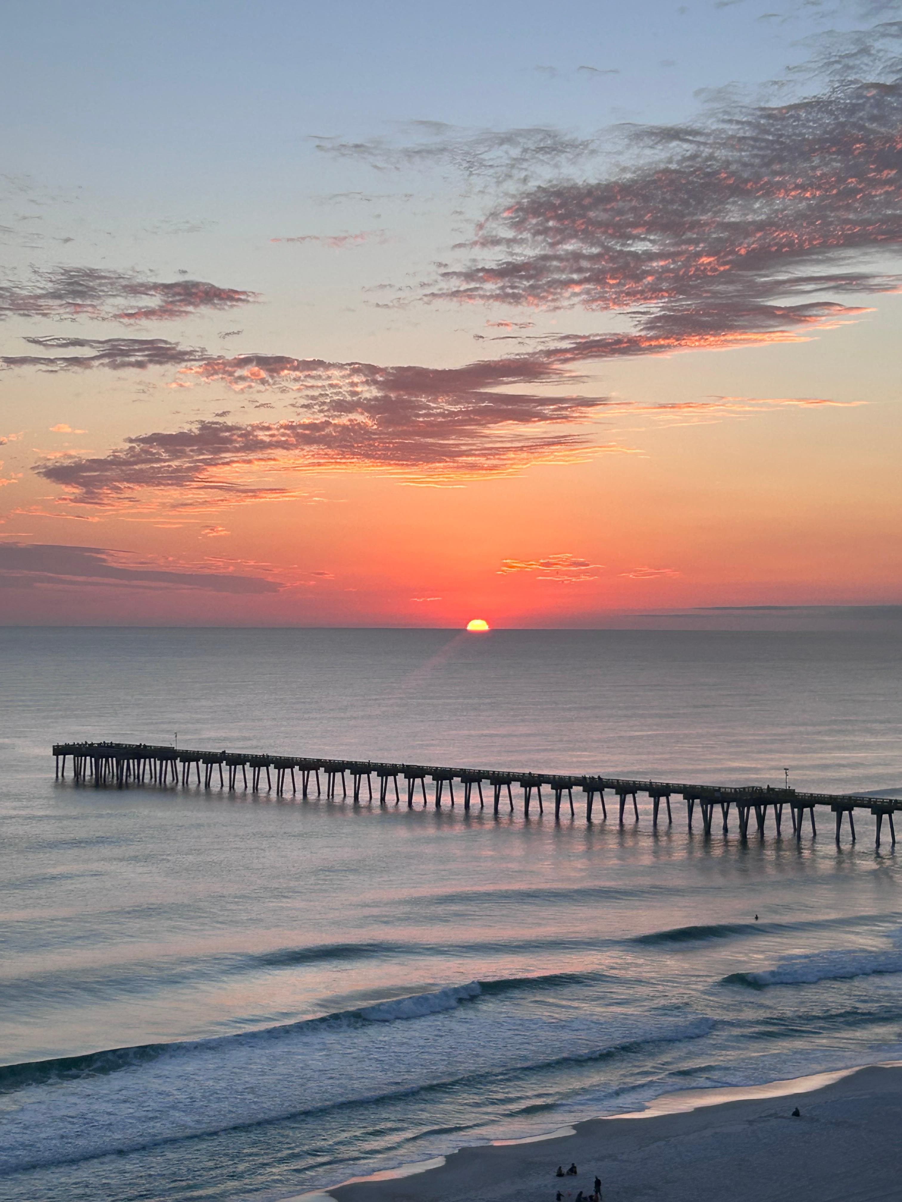 View of the pier and sunset from the patio of the condo.
