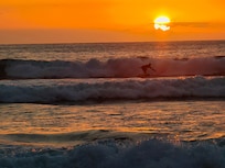 Surfer at sunset.
