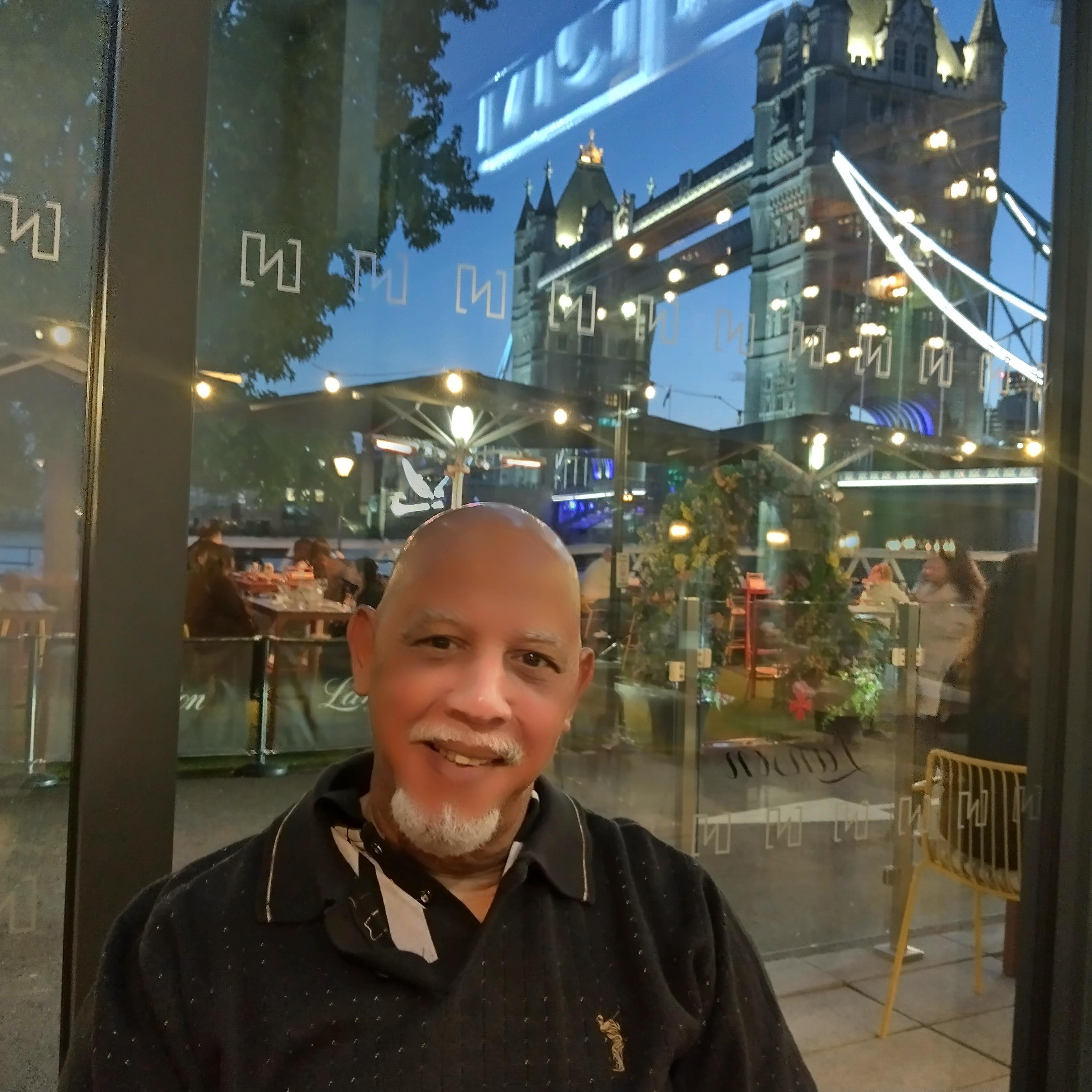 I'm in the Tower Restaurant with the Tower Bridge in the background.