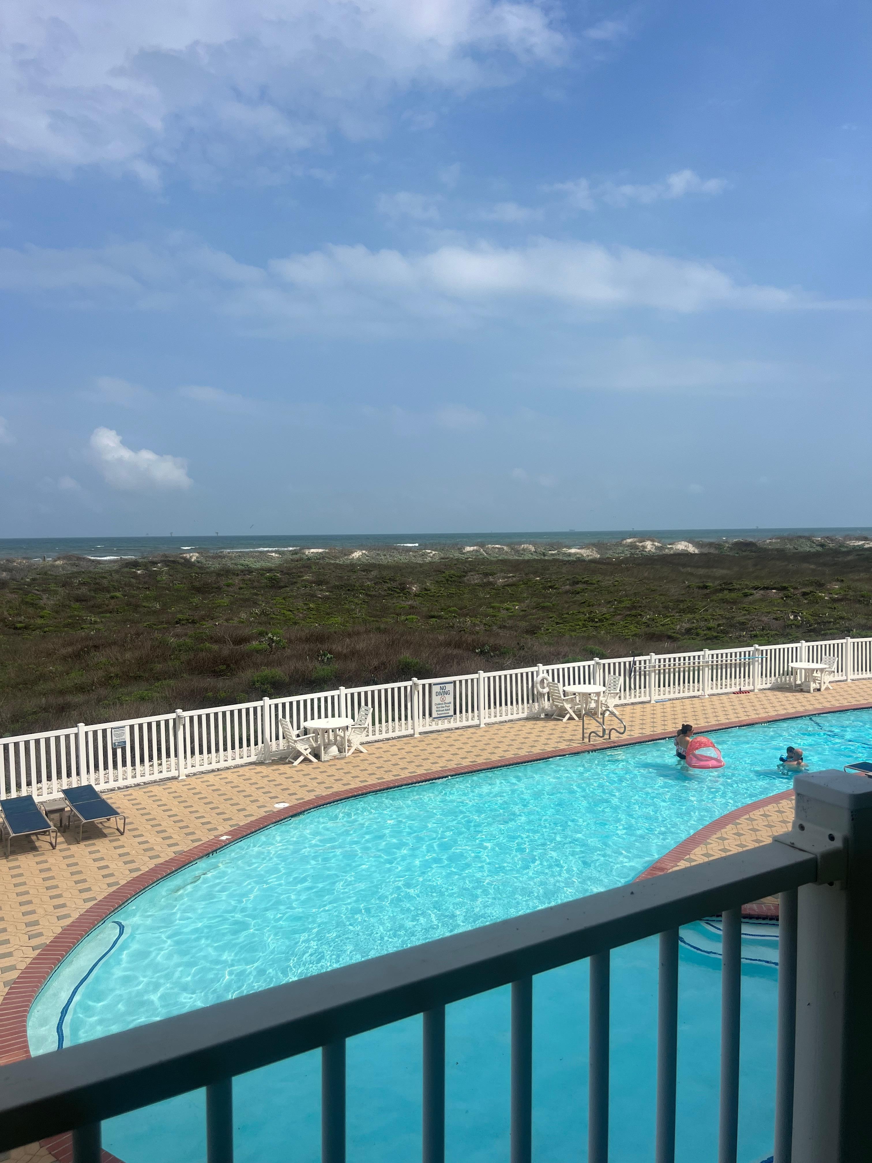 Pool and beach view from balcony