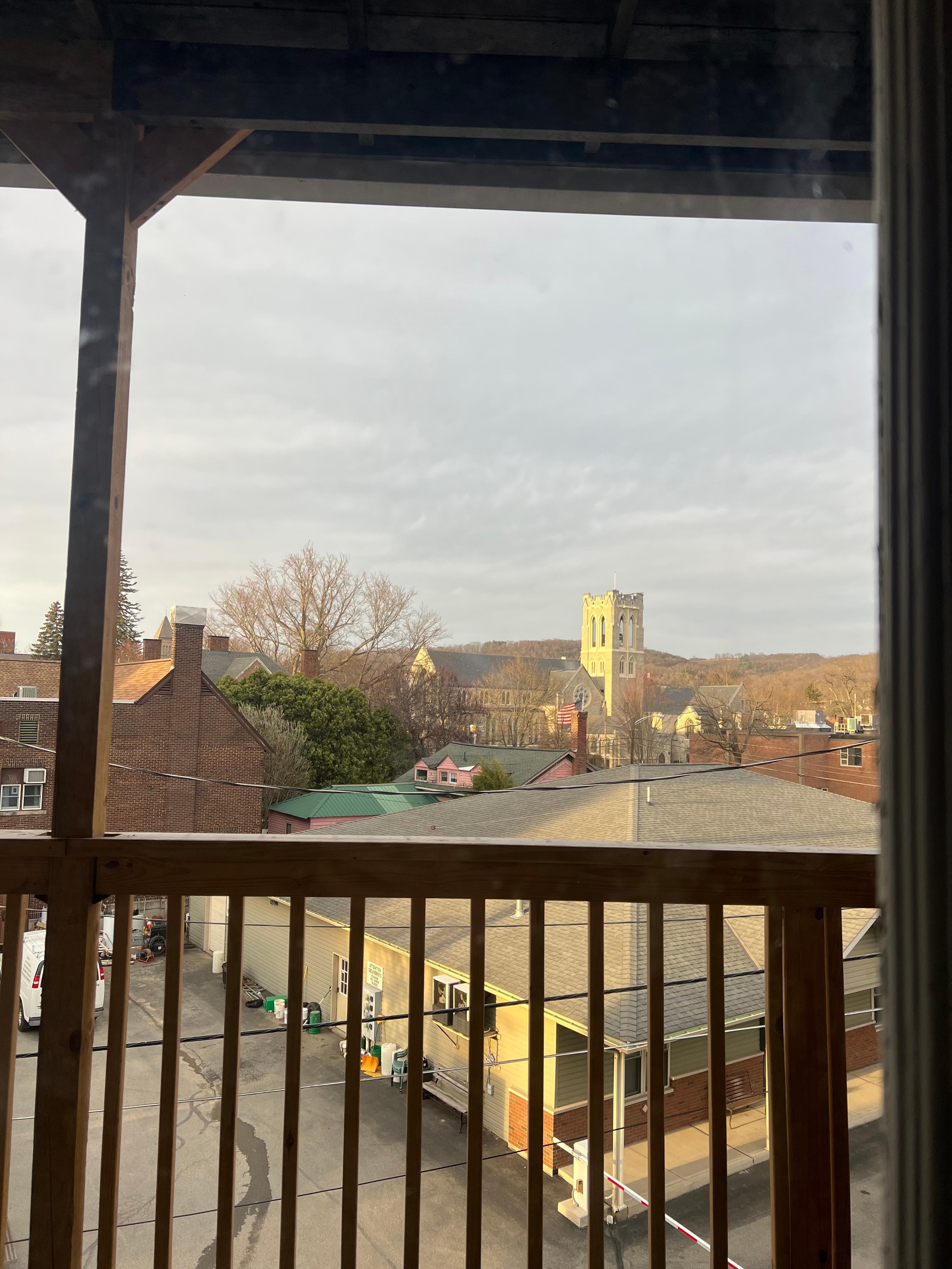 Deck view with the sun on the church and mountains! 