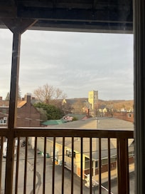 Deck view with the sun on the church and mountains!
