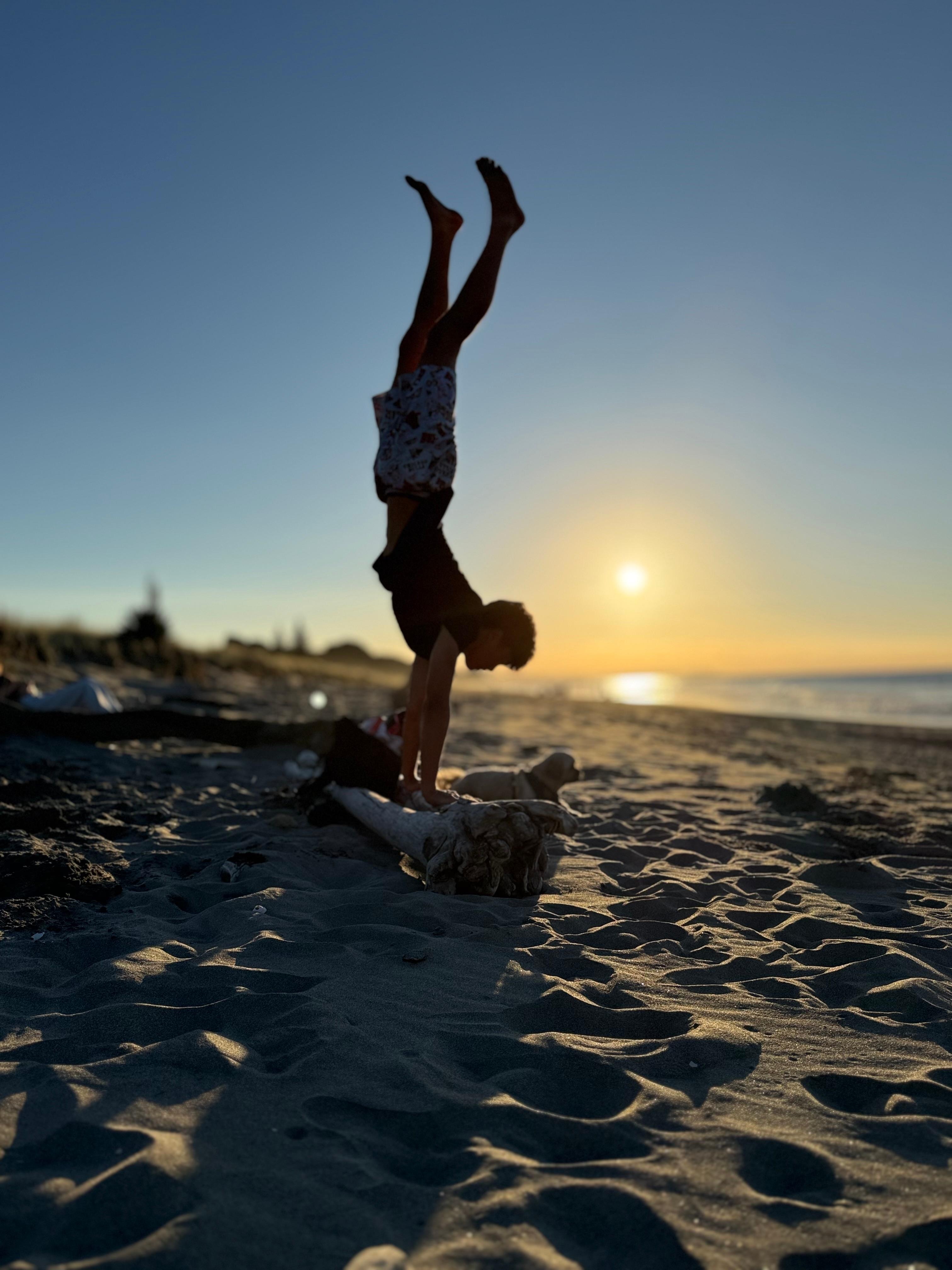 Make memories and see how long you can handstand with the setting sun whilst building a bonfire 😂