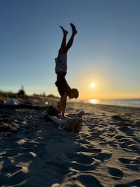 Make memories and see how long you can handstand with the setting sun whilst building a bonfire 😂