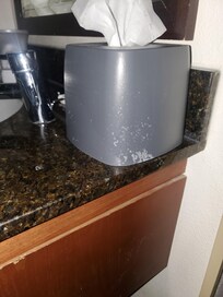 Kleenex box still dirty from the previous. I have video of the sink spicket behind that box was barely connected to the counter.