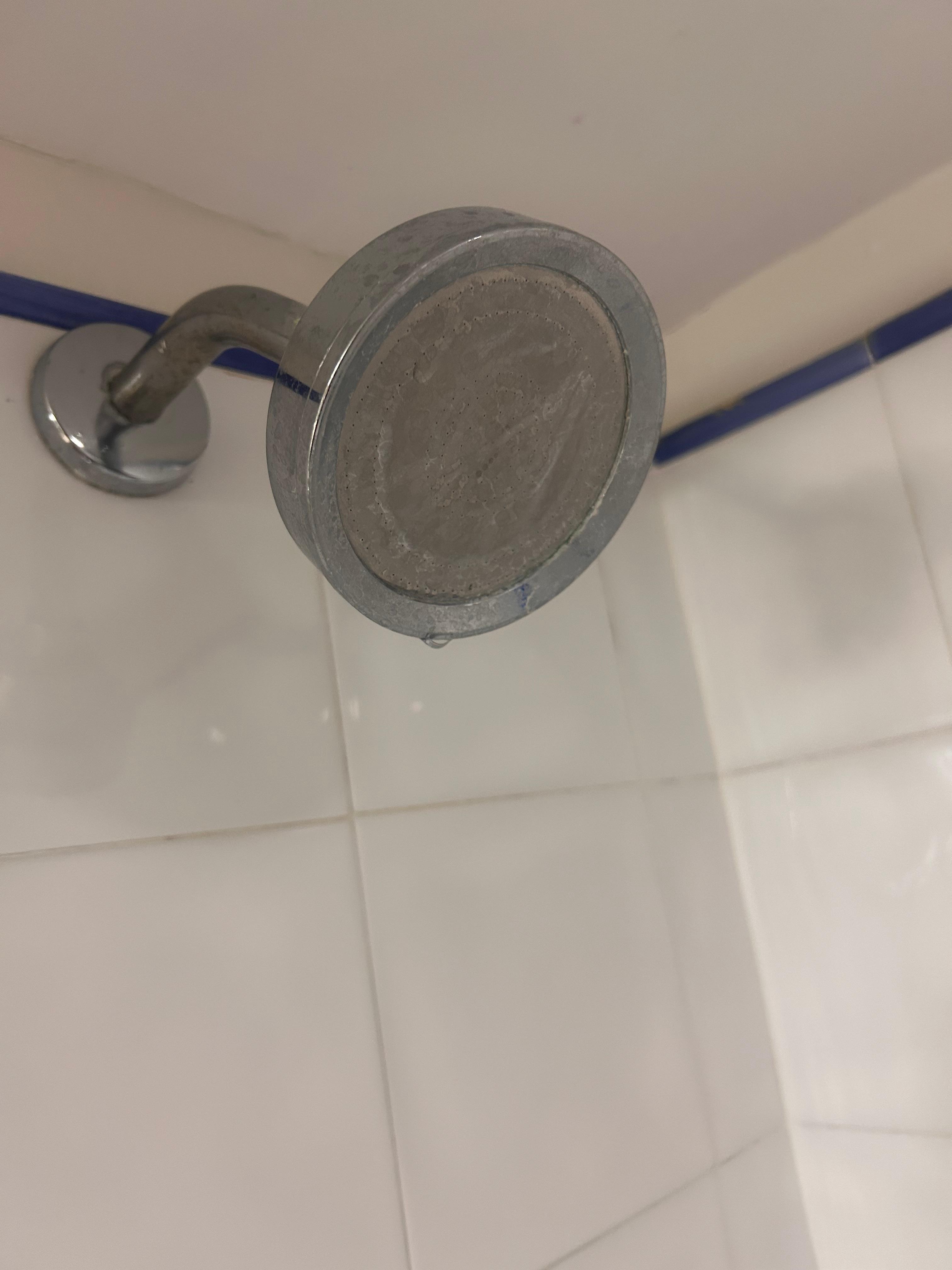 Calcium buildup on shower and the shower made lots of noise