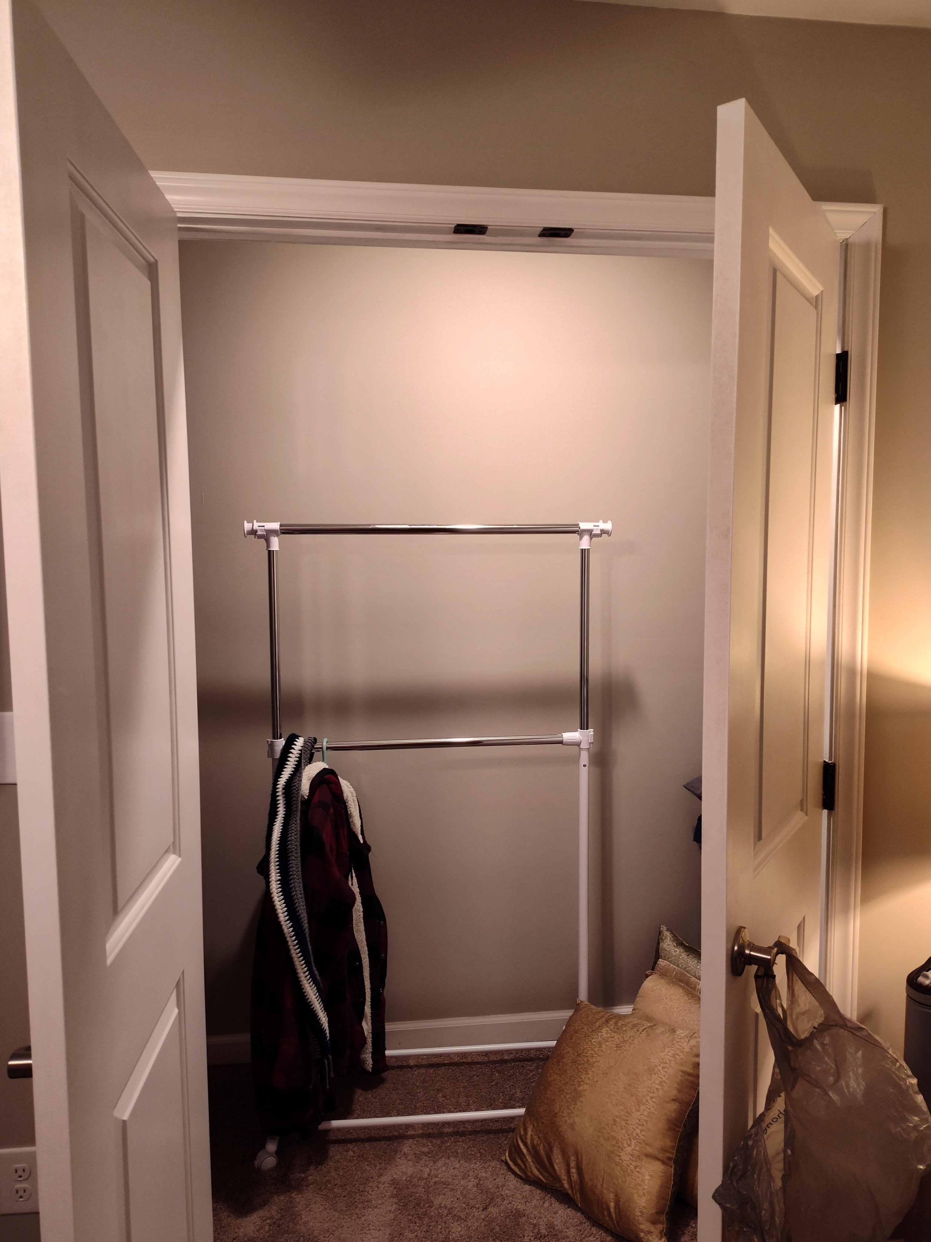 No rods in closets to hang clothes.  There is one mobile clothes rack in one bedroom that we moved to the living room to share.