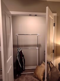 No rods in closets to hang clothes. There is one mobile clothes rack in one bedroom that we moved to the living room to share.