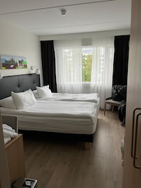Room was quaint. Unfortunately had to have window open at night for cooling off. Noise from street heard late.