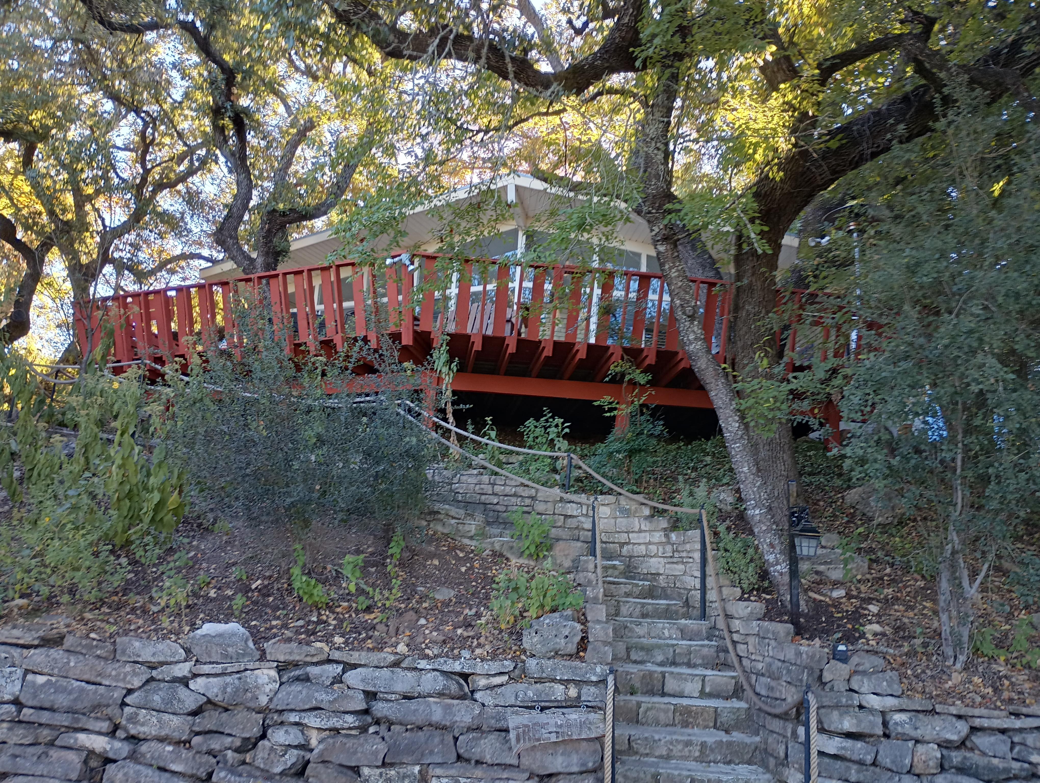 Stairs leading up to the house and the huge deck.