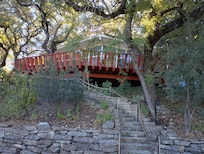 Stairs leading up to the house and the huge deck.