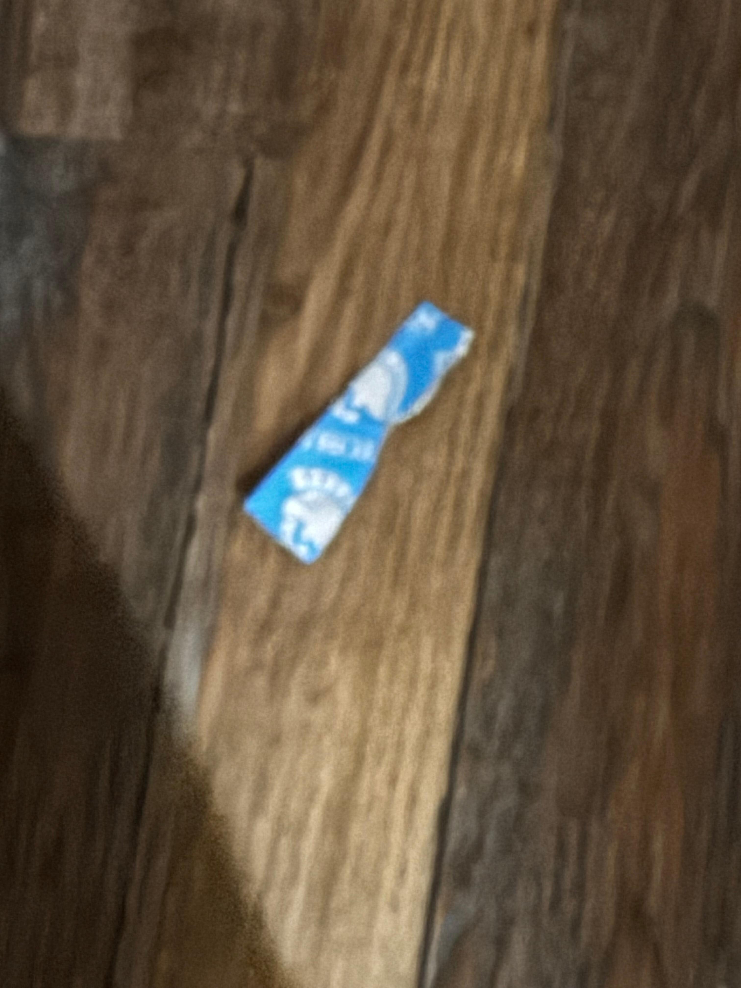 Condom wrapper found on the floor.
