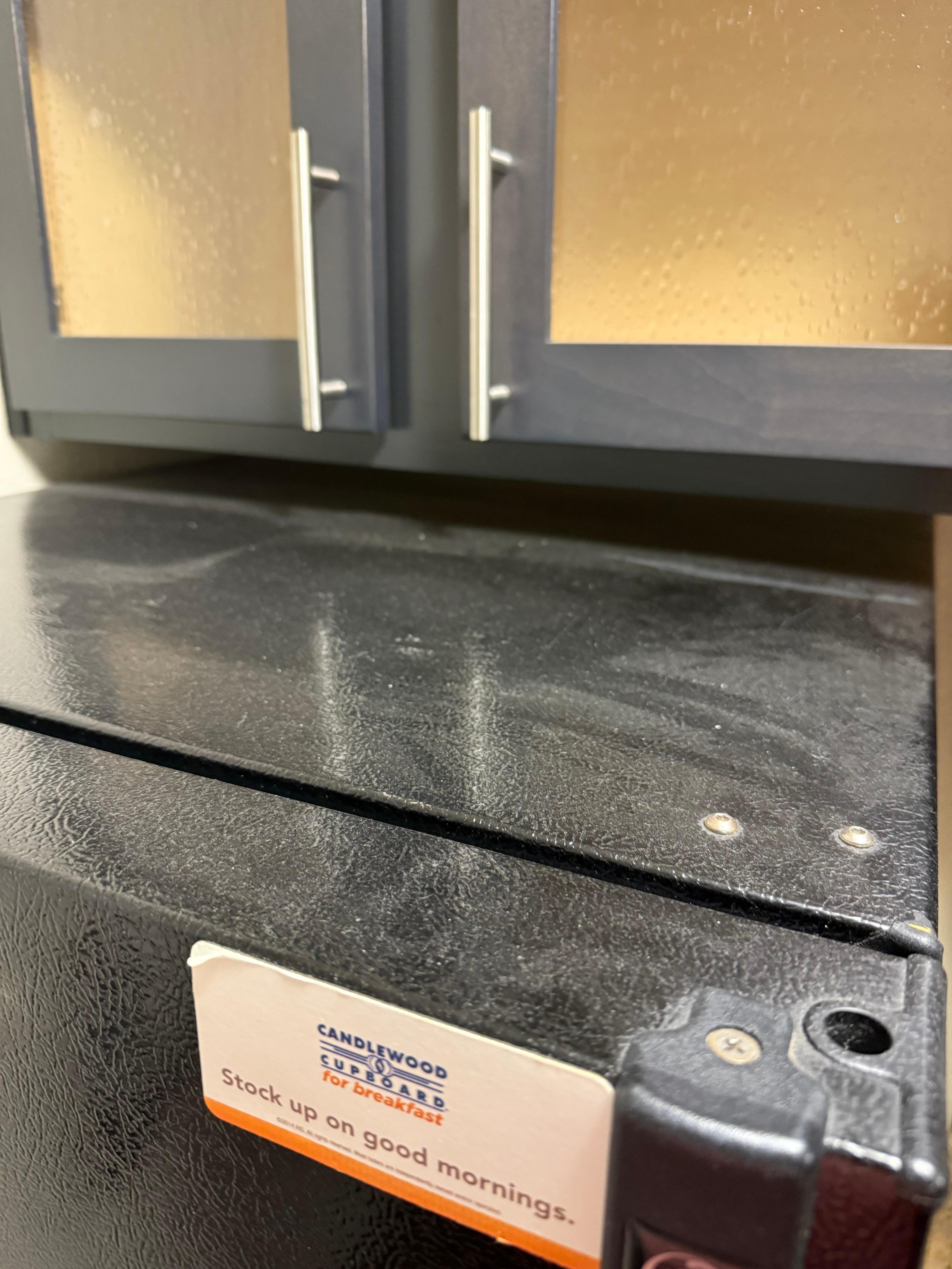 Dust on top of the fridge that you could write your name in